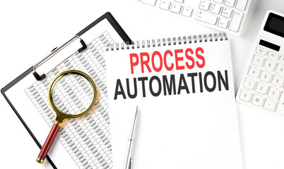 Office desk table with keyboard, notepad ,chart and calculator. Top view with text PROCESS AUTOMATION