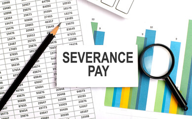 SEVERANCE PAY text on white card on the chart background - obrazy, fototapety, plakaty