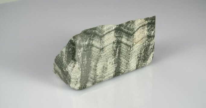 Skarn mineral rotation on white background . Primorsky Krai Russia.