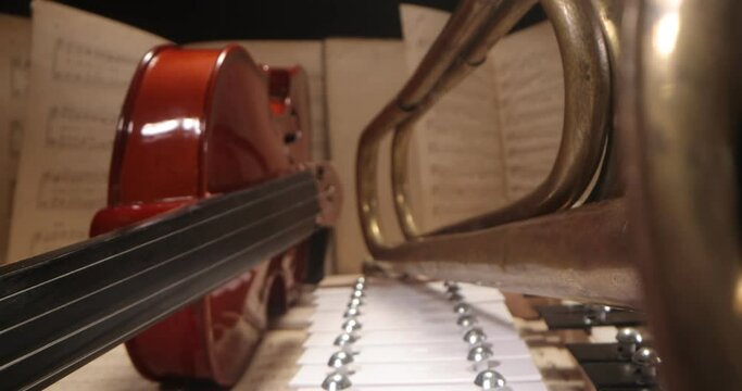 Music background, sheet music and musical instruments, violin, trumpet, cymbals. musical instruments among musical notes