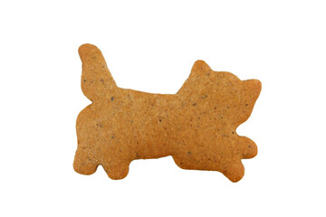 Gingerbread in a shape of running cat isolated on a white background 