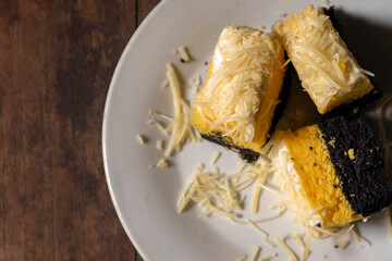 Bolu keju is Indonesian slice cake with cheese topping