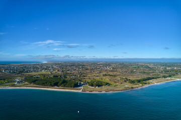 Aerial view of a french city on the atlantic ocean. Water edge on the beach. Blue sky for copy...