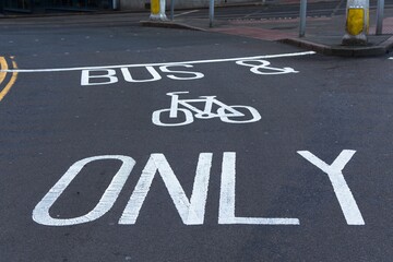 White painted road markings. Bus and cycles only. UK