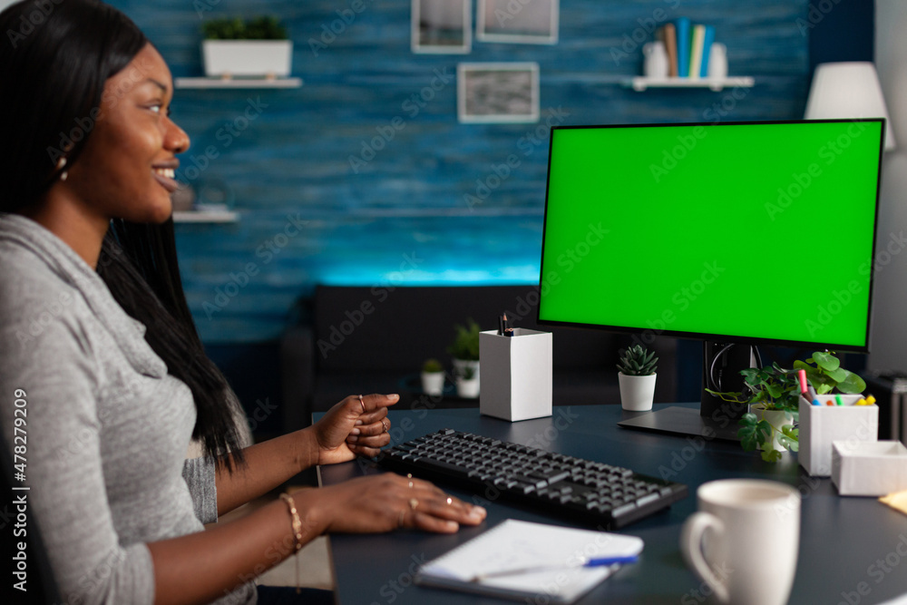 Poster entrepreneur using horizontal green screen on computer doing remote work at home. business woman loo