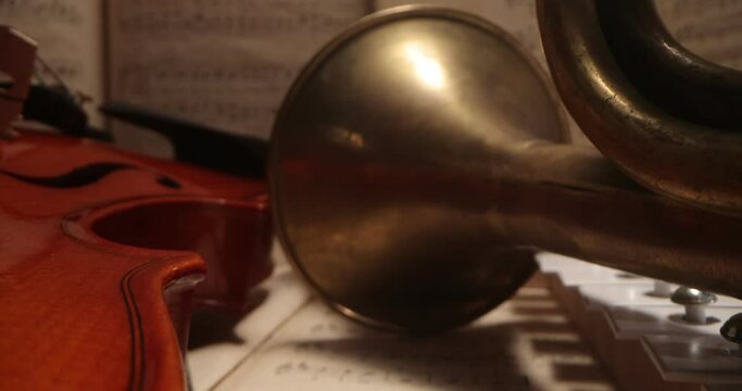 Music background, sheet music and musical instruments, violin, trumpet, cymbals. musical instruments among musical notes