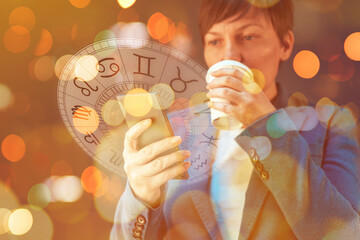 Astrology smartphone app, woman drinking coffee and reading horoscope and astrological predictions