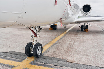 Close up view. Turboprop aircraft parked on the runway at daytime