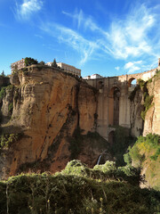 Rhonda. Spain. Andalusia. View of the bridge of Puento Nuevo from below. Vertical photo.