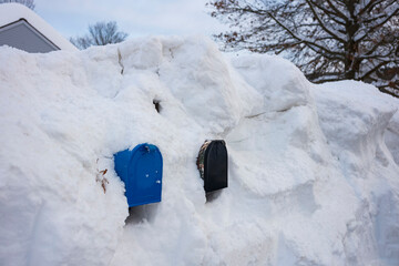 Deep snow from a blizzard covers mailbox
