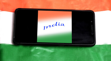 Mobile phone on the Indian flag, Concept for Indian Independence day and Republic day. A place for text on screen