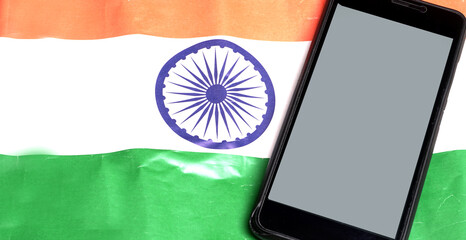 Mobile phone on the Indian flag, Concept for Indian Independence day and Republic day. A place for text on screen