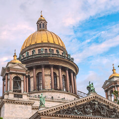 Fototapeta premium bottom view of the gilded dome and colonnade of St. Isaac's Cathedral against the background of the blue sky. Saint Petersburg. Russia
