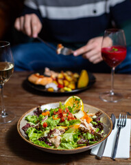 person eating salad 