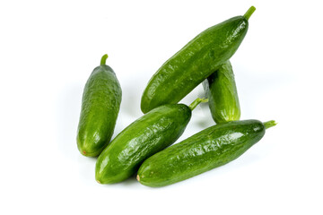 Freshly harvested mini cucumber on isolated white background