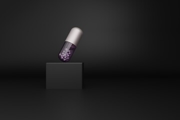 Metallic medical capsule with purple transparent part on a black pedestal. Conceptual modern 3D background