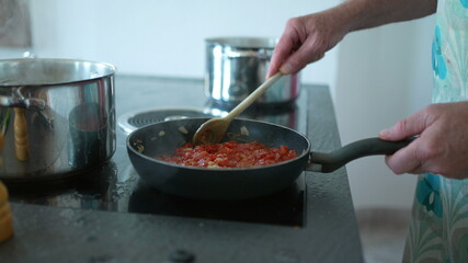 people cooking at home, candid granpa and adult daughter in kitchen preparing food