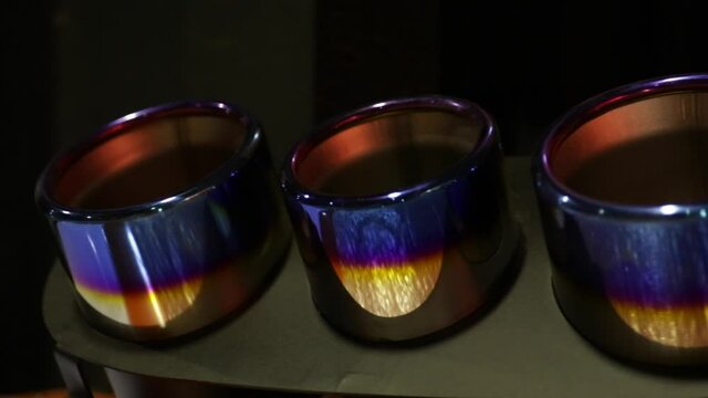 Shiny anodised chrome exhaust tip for super car