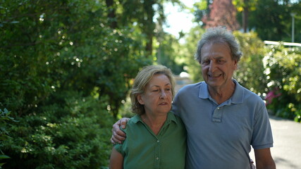 Obraz premium older couple walking together, senior people relationship outside in day walk