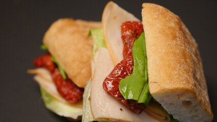 Delicious sandwich on a black background.