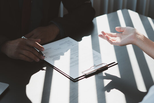 Executive reading a resume during a job interview and businessman Completing Application Form. Hiring concept
