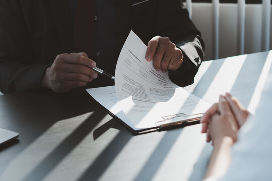 Executive reading a resume during a job interview and businessman Completing Application Form. Hiring concept