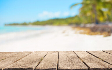 Wooden table top for product placement in front of beautiful tropical beach