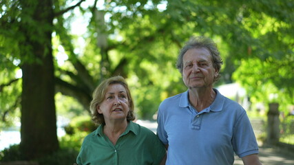 Happy senior couple walking together in afternoon walk