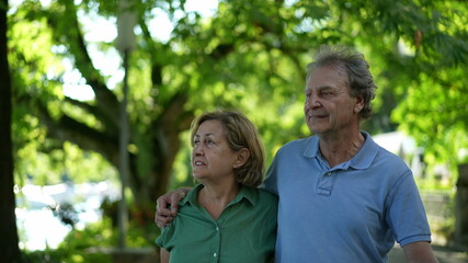 Happy senior couple walking together in afternoon walk