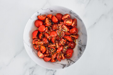 fresh ripe cherry tomatoes cut into cubes seasoned with olive oil balsamic vinegar and dukkah,...