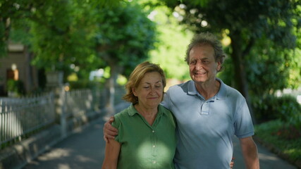 Happy senior couple walking together in afternoon walk