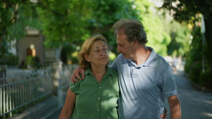 Happy senior couple walking together in afternoon walk