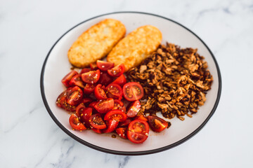 vegan hash brown cherry tomatoes and shredded teriyaki tofu, healthy plant-based food