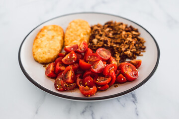 vegan hash brown cherry tomatoes and shredded teriyaki tofu, healthy plant-based food