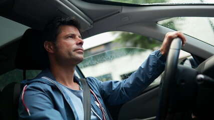 Handsome man driving car, 30s guy driver