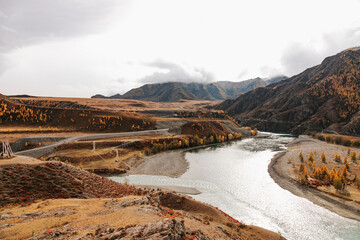 Mountain river surrounded by high rocks in Altai