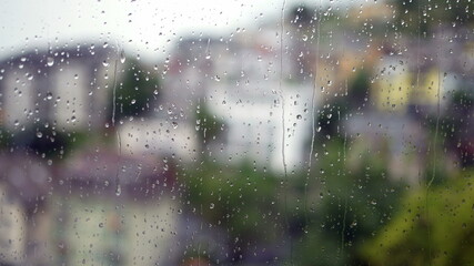 Droplets on window during rainy day