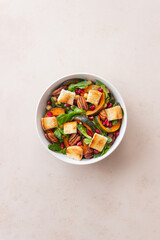 Salad with pumpkin, pomegranate, pecans and croutons. Healthy eating. Vegetarian food.