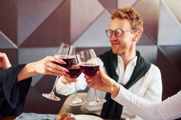 Young couple and mother. Indoors of new modern luxury restaurant