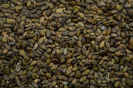 Nourishment is cultivated, abundance of nutritious food and harvest horizontal backgrounds concept with full frame image of stack of shelled pumpkin seeds and no people