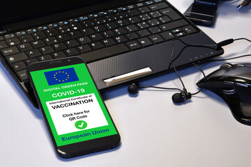 Covid-19 green passport. The digital green pass of the European Union on the screen of a smartphone...