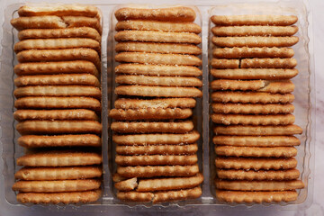 close up of cheese cookies in a packer on table 