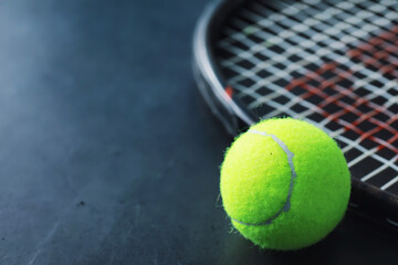 Sport and healthy lifestyle. Tennis. Yellow ball for tennis and a racket on the table. Sports...