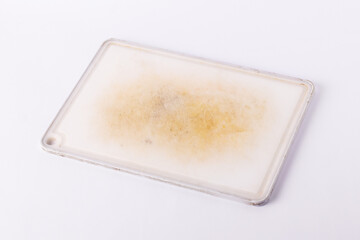 Old dirty kitchen board on a white isolated background.