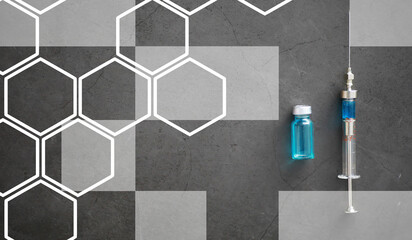 small jars with injection and syringe for injection on a blue background near the chemical formula