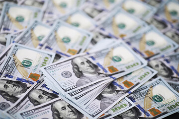 Group of money stack of 100 US dollars banknotes a lot of the background texture. Cash money in a large pile as a finance background.