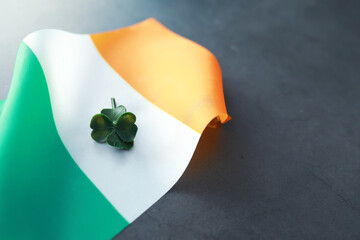 Saint patrick's day background with ireland flag. Religious Christian holiday. Four-leaf clover...