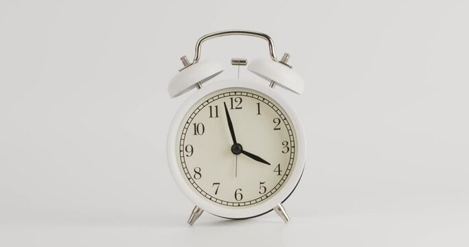 Alarm clock isolated on white background Showtime 03.00 am or pm, Timelapse 4 hours.