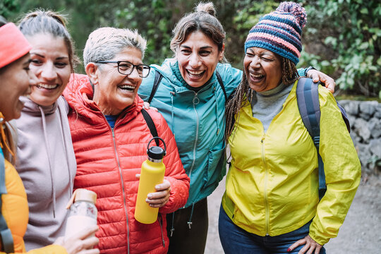 Multiracial Women Having Fun During Trekking Day In To The Wood - Focus On African Female Face