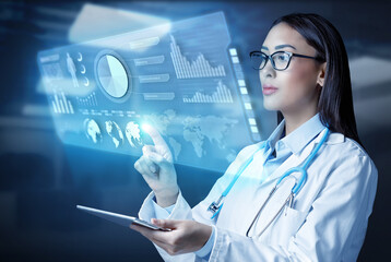 Female doctor holding a tablet computer and touching medical graphs on virtual screen. Medical...